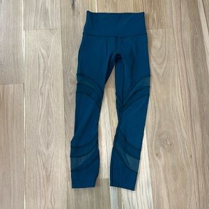 Teal Lululemon leggings with mesh detailing